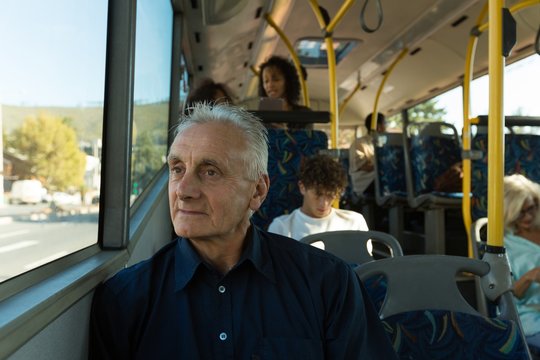 Senior Man Travelling In The Bus