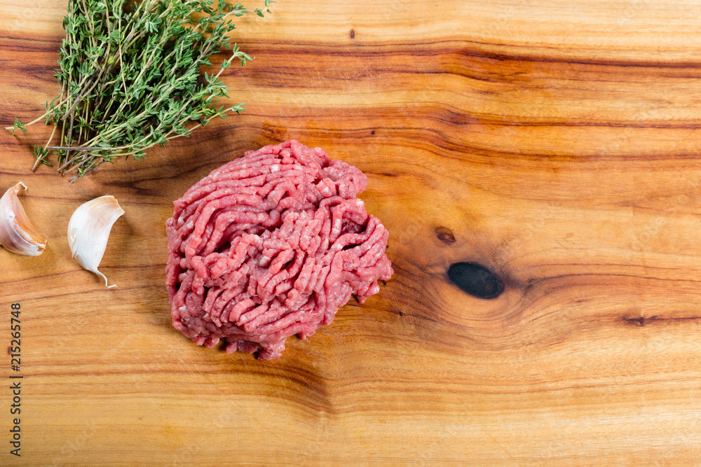 Wall mural raw beef mince on chopping board