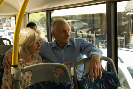 Senior couple travelling in the bus