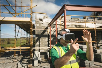 Engineer experiencing VR headset at the construction site