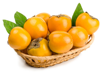 persimmons in basket on white background