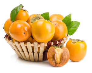 persimmons in basket on white background