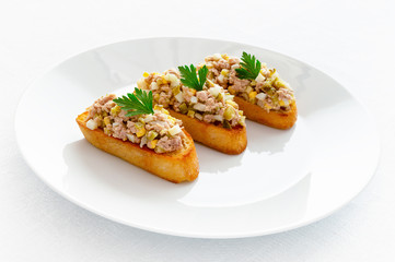 fried toasts with cod liver salad