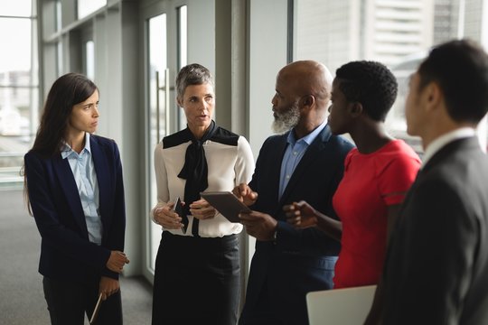 Group of serious businesspeople having a discussion over the