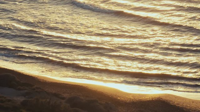 Golden sun reflaction on waves