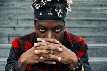 Closeup of Young Fashionable Black Man Looking Straight into Cam