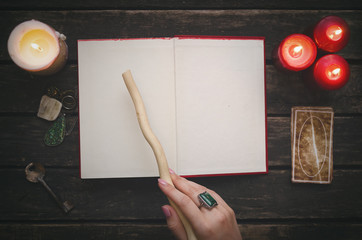 Open book of magic with blank pages and tarot cards on fortune teller table background. Futune...