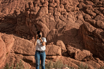 Photographer taking landscape photos in the Tamlalt cliffs