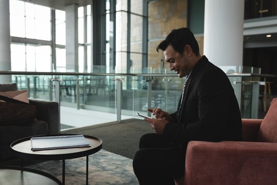 Businessman using in mobile phone in the office