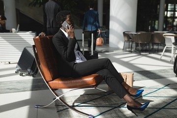 Businesswoman talking on the phone in office