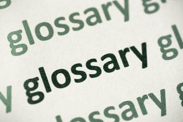 Fototapeta na wymiar word glossary printed on paper macro