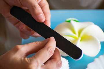 Manicure at home. A woman polishing her fingernails. Nail Care.