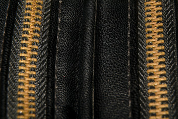 gold closed lightning on black leather
