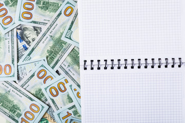 Notebook for notes on money background from one hundred dollars
