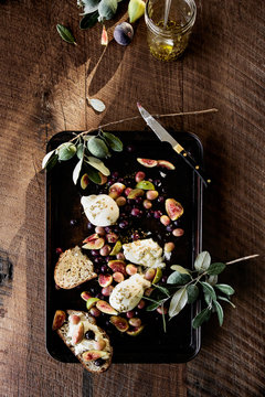 Roasted olives and burrata with toasted bread