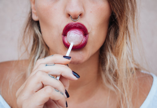 Young woman with a lollipop