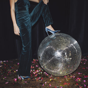 Woman Posing With Disco Ball