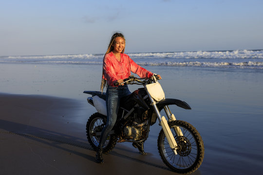 Young woman on a Motocross bike