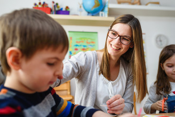 Preschool Teacher with Children at Kindergarten - Creative Art Class