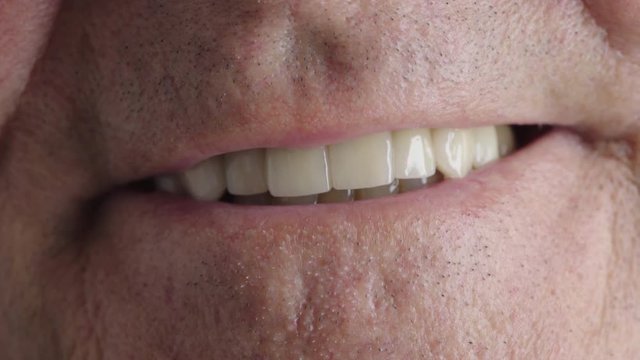 close up of elderly man mouth smiling healthy teeth