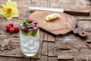 Summer cocktail with mint, lemon and ice