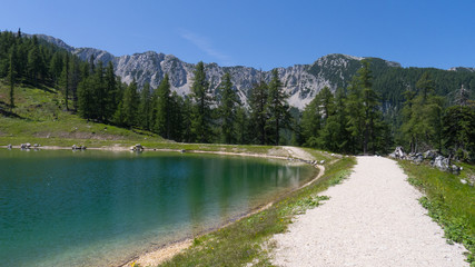 path around a water reserves lake in austrian high alpien mountains