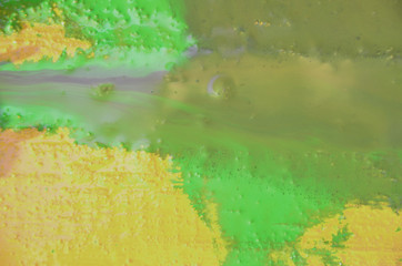 bright yellow wood surface as background. Abstract hand drawn watercolor. Colorful splashing on the wood