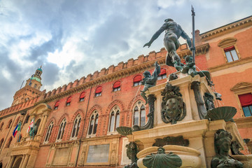 Nettuno 1567 bronze statue and fountain in front of Accursio palace, built in 1290, in Piazza Maggiore square, the seat of the municipal government of Bologna city in Emilia region of Italy. © bennymarty