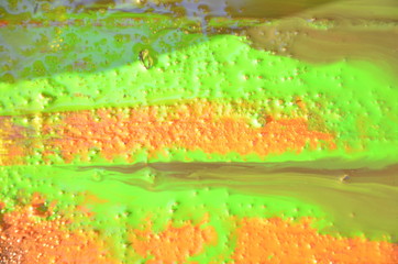 bright yellow wood surface as background. Abstract hand drawn watercolor. Colorful splashing on the wood