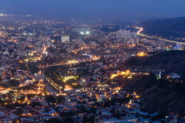 Naklejka premium Beautiful aerial view of Tbilisi city with illumination, Tbilisi, Georgia