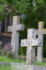 Graveyzard stone in the form of weathered stone crosses