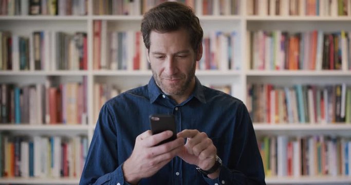 portrait pensive young businessman using smartphone texting browsing online messages successful entrepreneur on mobile phone slow motion