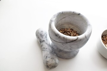 Mixture of sunflower, sesame and chia seeds in a marble morter