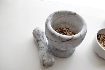 Mixture of sunflower, sesame and chia seeds in a marble morter