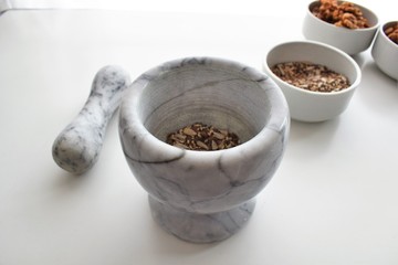 Mixture of sunflower, sesame and chia seeds in a marble morter