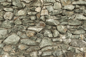 part of the wall from the laying stones of stones. ancient architecture. building