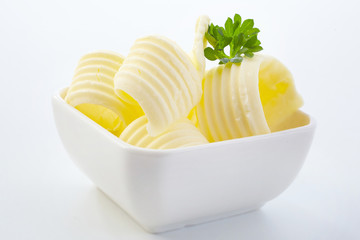 Elegant curls of fresh butter in a small dish