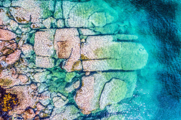 Stones in the Sydney water close up from above