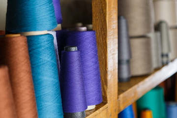 Colored skeins on the shelfs
