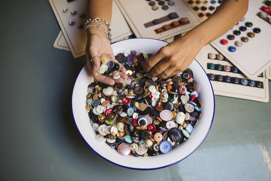 Female hands looking for buttons