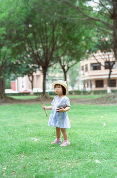 little girl with a rugby ball
