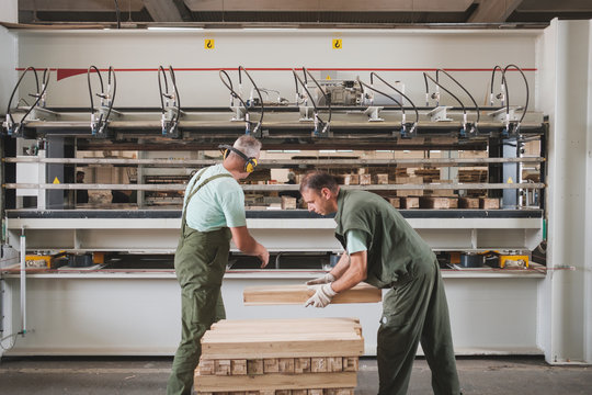 People Working At The Furniture Factory
