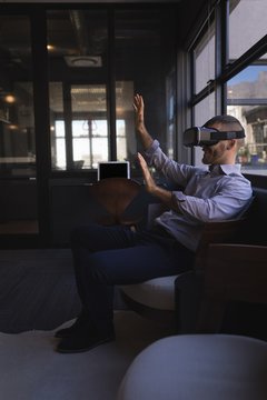 Businessman using virtual reality headset