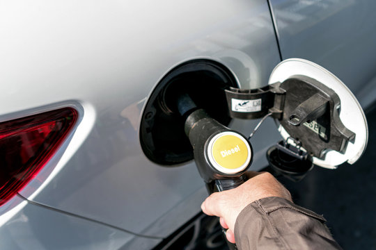 car refueling diesel pump at petrol station