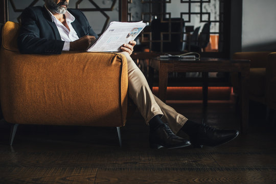 Man Reading Newspaper
