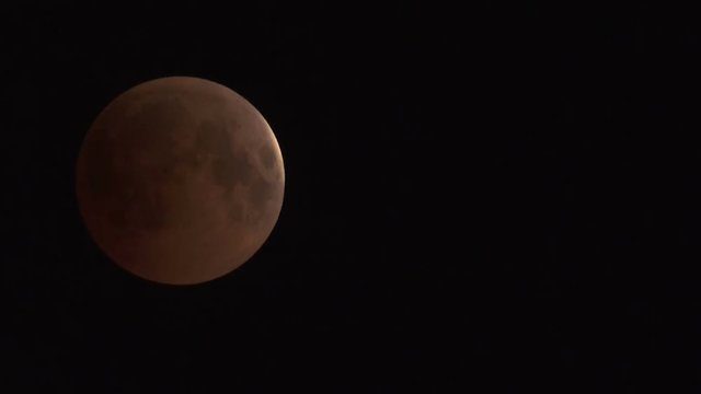 Lunar Eclipse on 28 of July 2018 - the moon appears darkened as it passes into the earth's shadow. It was observed in the European part of Russia. Real time video.