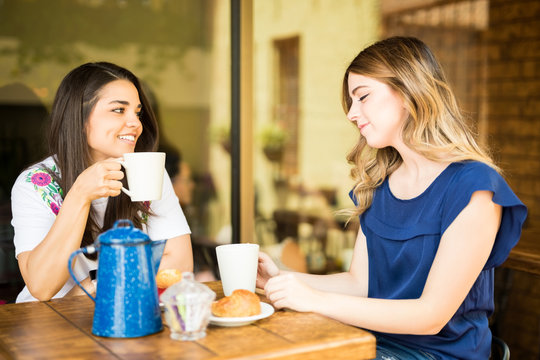 Female friends hanging out at coffee shop