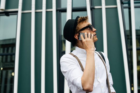 Young stylish guy with phone