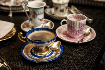 elegant cooffe cup on a dark wooden table.