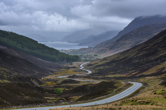 Winding highway through the typical Scottish countryside in the highlands of Scotland, United Kingdom
